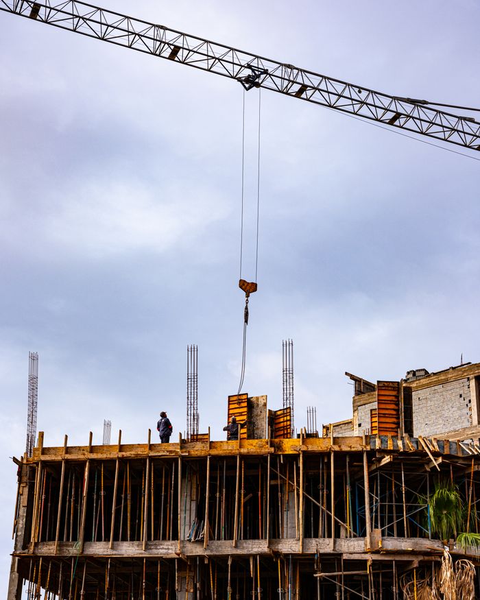 Building under construction with crane in Marrakesh, Morocco showcasing urban development.